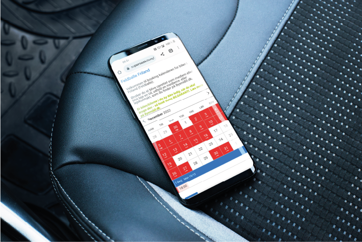 Mobil med screendump af Byens Bil booking system